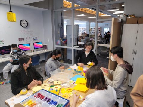 Making Space to Aid Ukraine—Students gather in the Media Centers Makerspace to create donation tokens for the donation drive that will take place from March 21 to April 1. Monetary donations will be received by volunteers at the tables in the main lobby.
