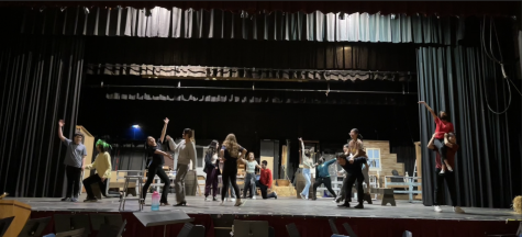Jumping for joy—Oklahoma! cast skips with their partners in preparation for the box social dance at the beginning of Act 2.
