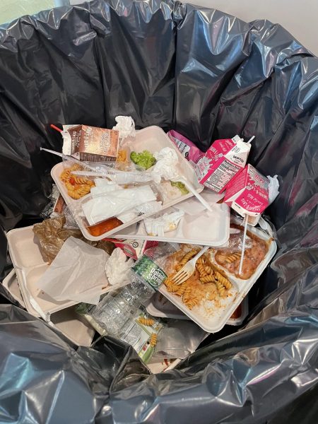 The Entreé of Thursday’s Garbage Can: Trashed Pasta—
A typical garbage bag of the cafeteria consists of plastic garbage, paper garbage trays, and, of course, unfinished food. Seen here is the pasta, broccoli, and milk that students chose not to finish. 