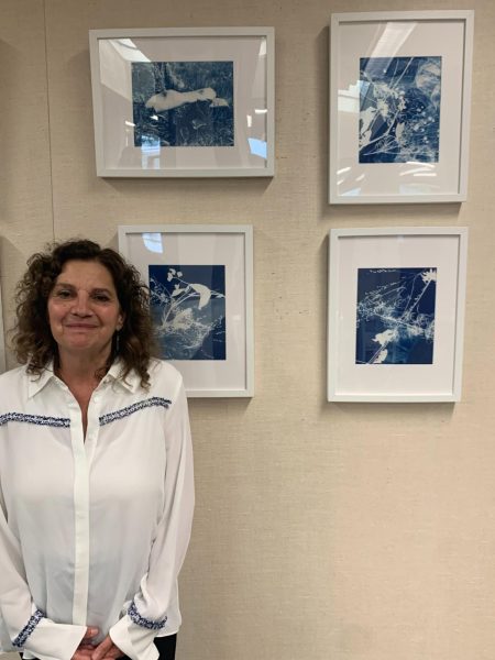 Stancati’s Cyanotypes—Lisa Stancati proudly stands in front of her exhibition, Flora and Fauna.