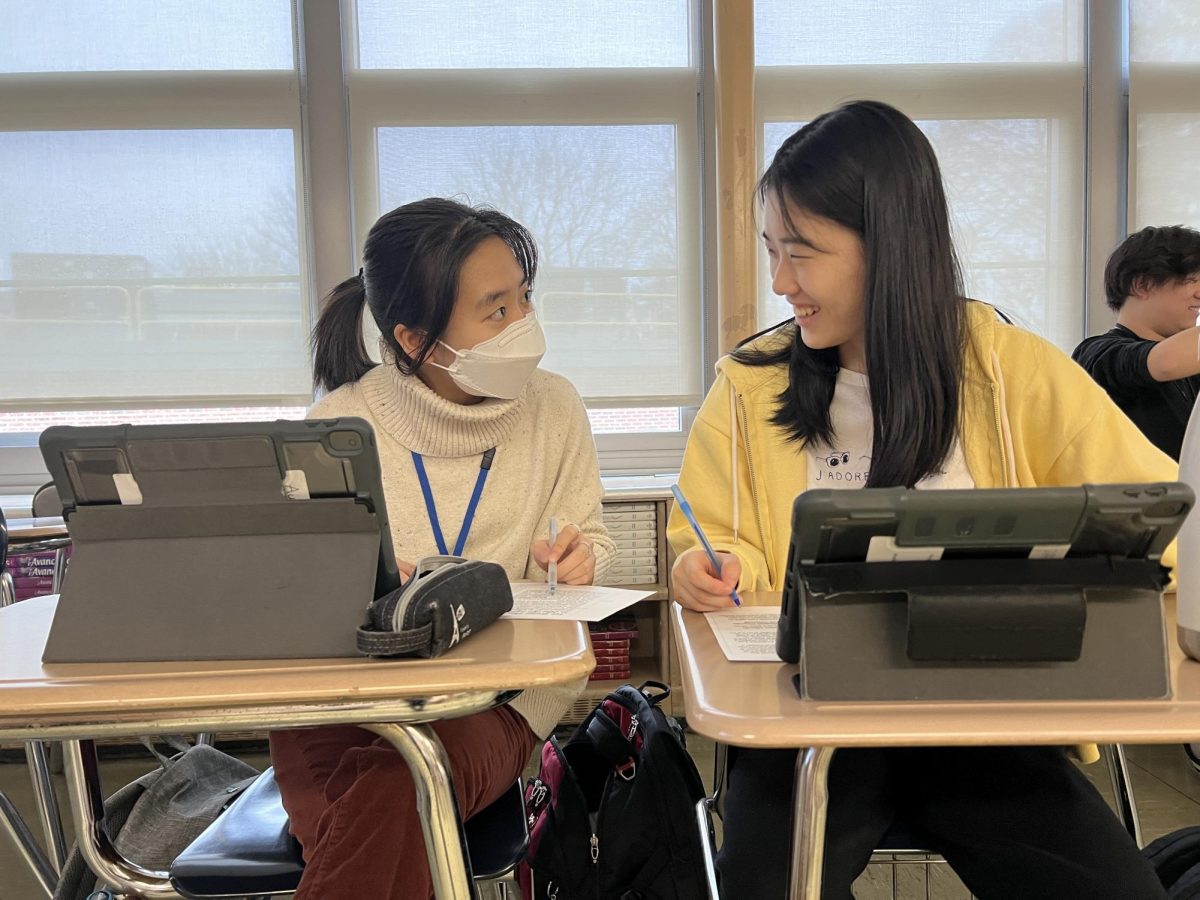 Two students work together in Mme. Finazzo’s 8th-period AP French class.