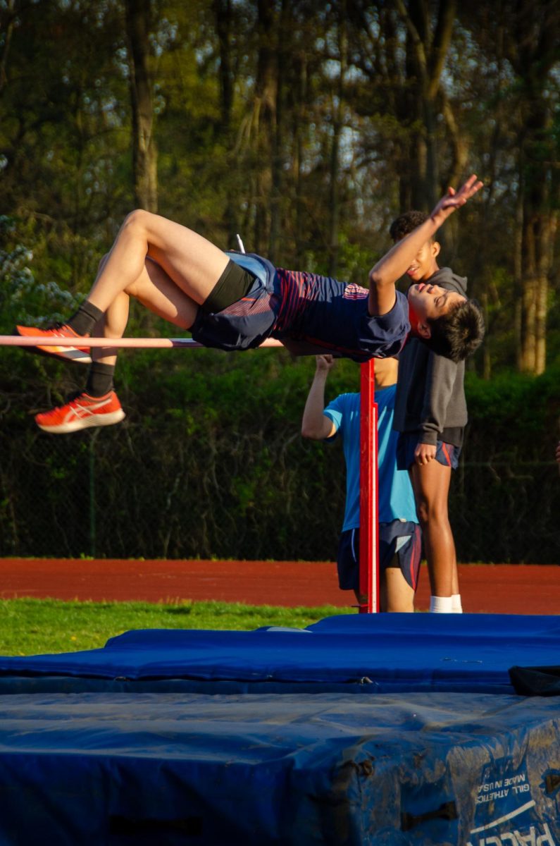 Calvin Chang Clinching a New Height—A high jump attempt by Chang during one of the Spring meets in the 2023 season.