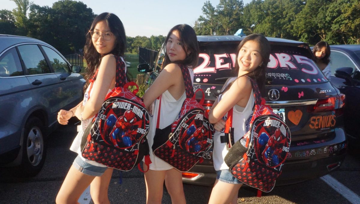 Your Friendly Great Neck Spider-Men—(From the left) Seniors Elizabeth Liu, Sharon Xu, and Althea Ou show off their backpacks featuring the popular Marvel superhero.