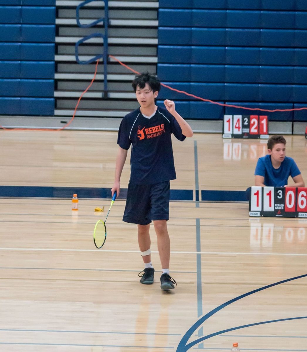 A Stoic Celebration—Haoran Xia celebrates winning a point in the third set of the semifinal match during the county tournament at Plainview Middle School.