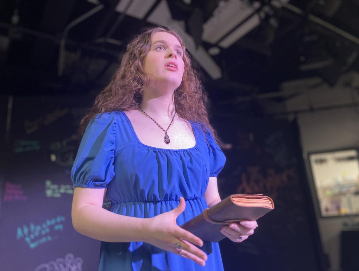 Yet Hope Stayed Behind—Beatrice Pitt Stoller performing the opening scene as her character, Pandora, the complete center of attention. Pandora is the creator of the Five and a Half Proclamations of the Lobe, the document that enforces societal roles onto people depending on their earlobe.
