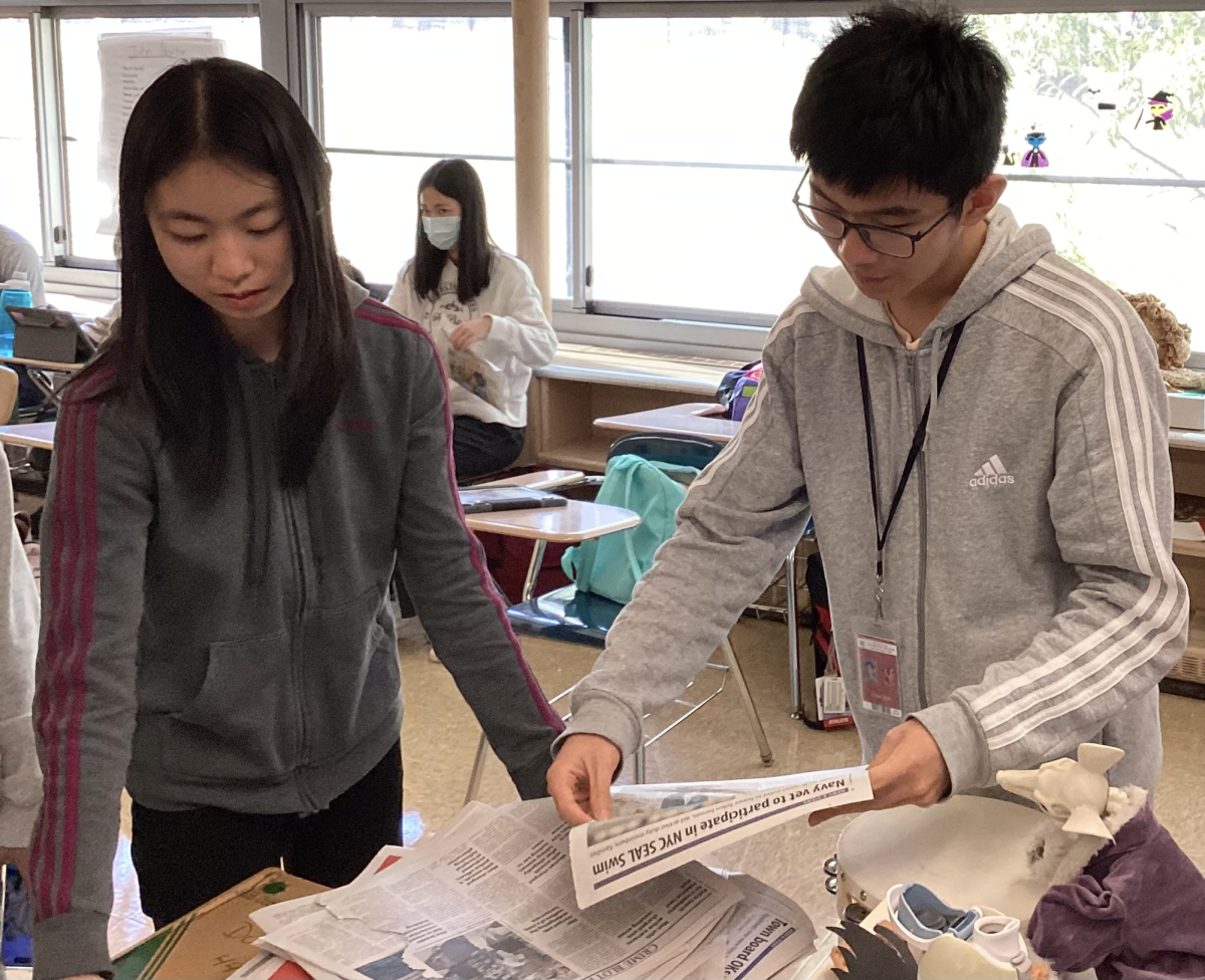 History In Action - Exit 33 members, Cassandra Zheng and Eric Chen, work on blackout poems