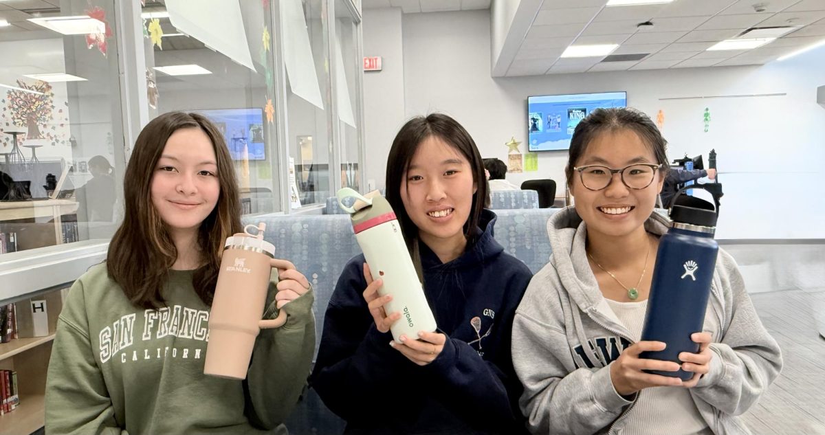 Trendsetters in Action - Juniors Sophie Forster, Sydney Shan, and Rebecca Xu pose with their favorite water bottles. The Stanley, Owala, and Hydroflask are the most sought after water
bottles right now.