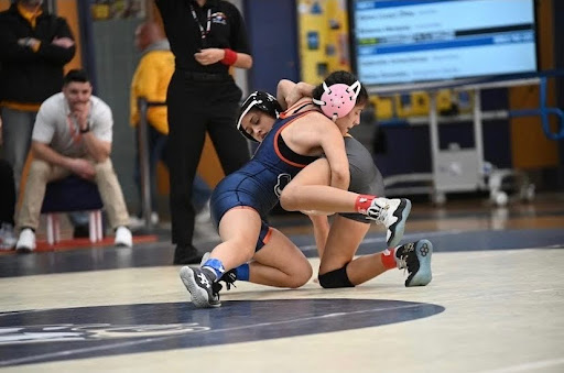 Grappling Her Way to the Top — Junior Edith Atahualpa faces an opponent from Uniondale High School at the 2025 Girls Nassau County Championship at Bethpage High School. Atahualpa took third place in the 107 lb class, earning All County Honors.

