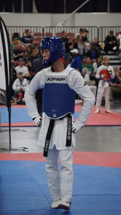 The Breaking Point - Great Neck South High student athlete Herman Li waits between rounds at USA Taekwondo National Tournament. When he’s not competing on the national level, Li often finds himself balancing his school life with his relentless Taekwondo training.
(Photo courtesy of Herman Li)
