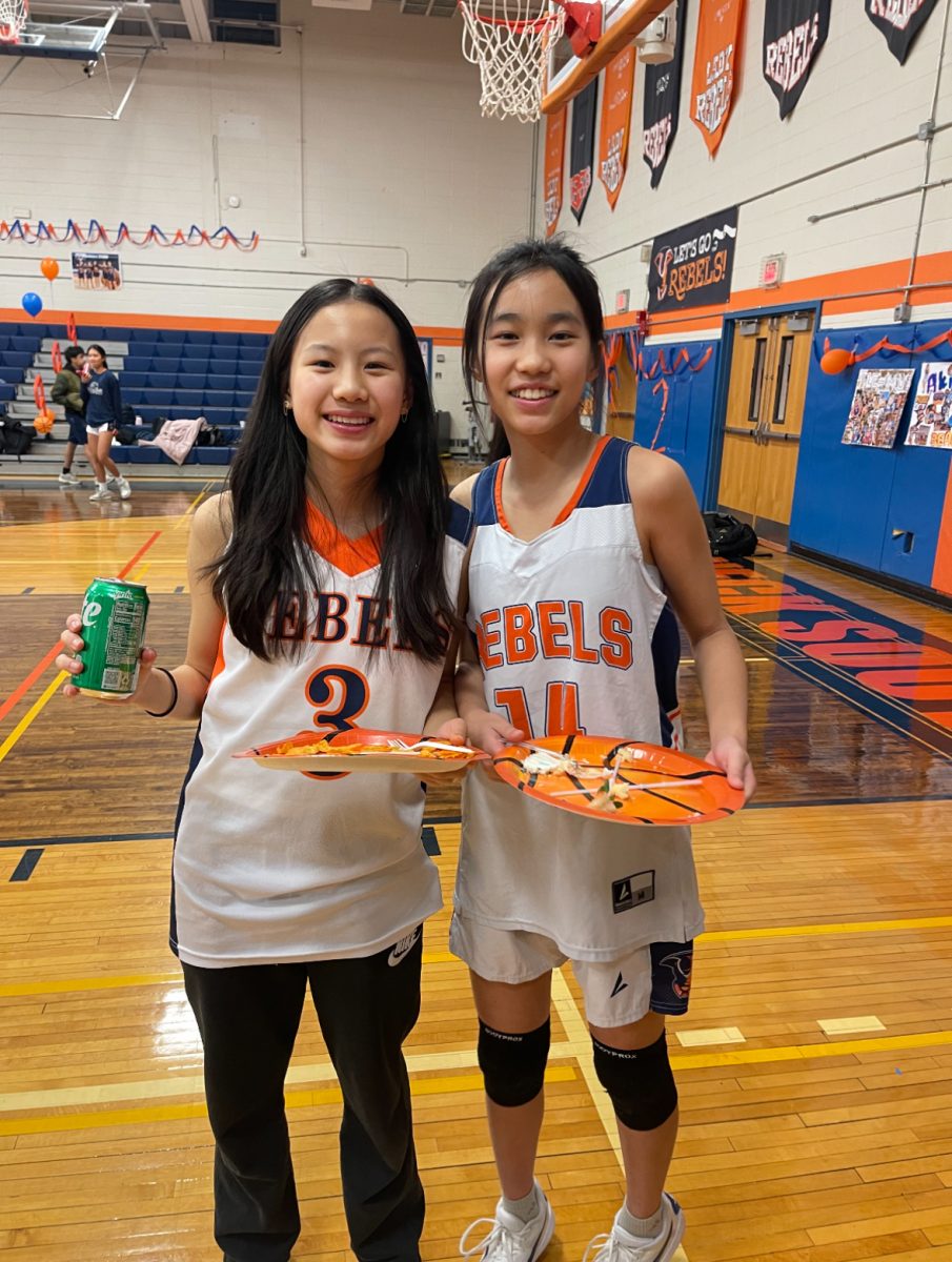 From Junior High to Junior Varsity—Great Neck South Middle students Elsa Lo and Hayden Kong celebrate the graduating seniors at the end of the 2024-2025 girls basketball season. While both girls played at the high school level, they rotated between playing for the varsity and junior varsity teams, switching positions with each other on the gameday rosters.